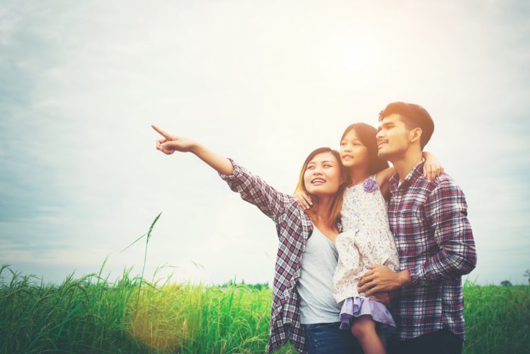 family-mother-father-child-meadow-dad-carrying-d